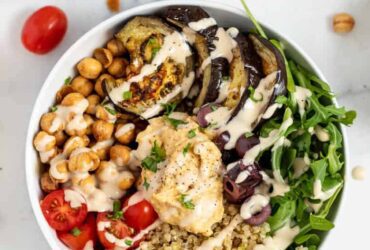 Enjoy This Delicious Mediterranean Quinoa Bowl with Roasted Red Pepper Sauce