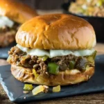 Sloppy joe sandwiches filled with seasoned beef, onions, peppers, and melted cheese.